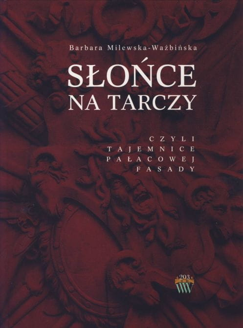 Okładka do książki "Słońce na tarczy, czyli tajemnice pałacowej fasady". Na brązowej okładce sztukaterie. 