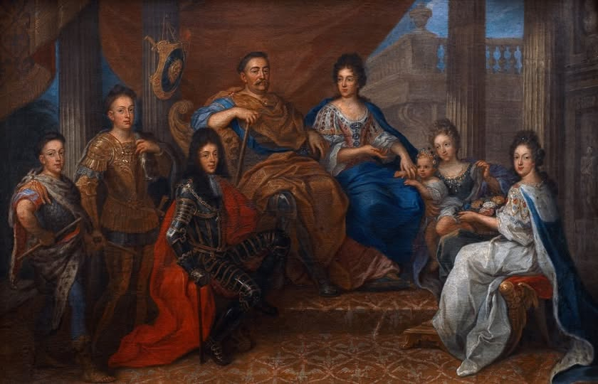  Obraz został namalowany przez dworskiego artystę, działającego w kręgu monarchy. Przedstawia rodzinę królewską – obok Jana III siedzi Maria Kazimiera. Po lewej stronie ukazano synów Sobieskich – Jakuba Ludwika, Aleksandra Benedykta i Konstantego Władysława. Po prawej zaś, obok królowej – żonę Jakuba, Jadwigę Elżbietę Amalię z córeczką Marią Leopoldyną oraz córkę Sobieskich – Teresę Kunegundę. 